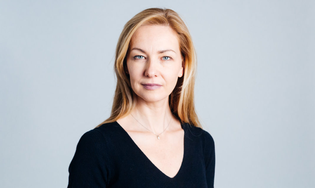 Woman looks at camera with straight face