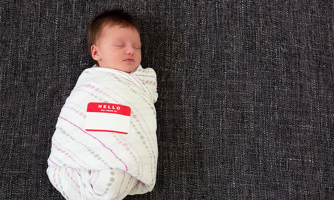 Sleeping swaddled infant with a 