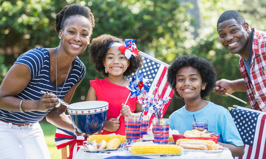 Family of four celebrating Memorial Day at home