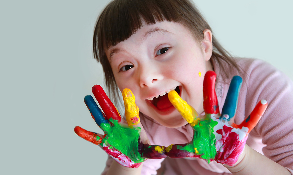Little girl with paint on her hands