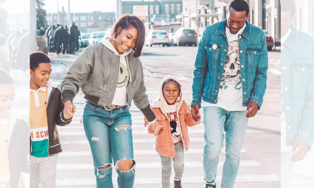 Mori and her family smiling as they walk down a street in Detroit