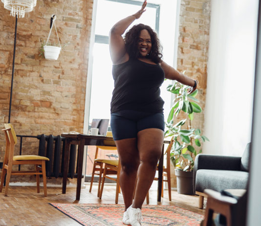 Woman dancing in a living room