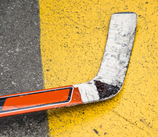 A hockey stick laying on the street
