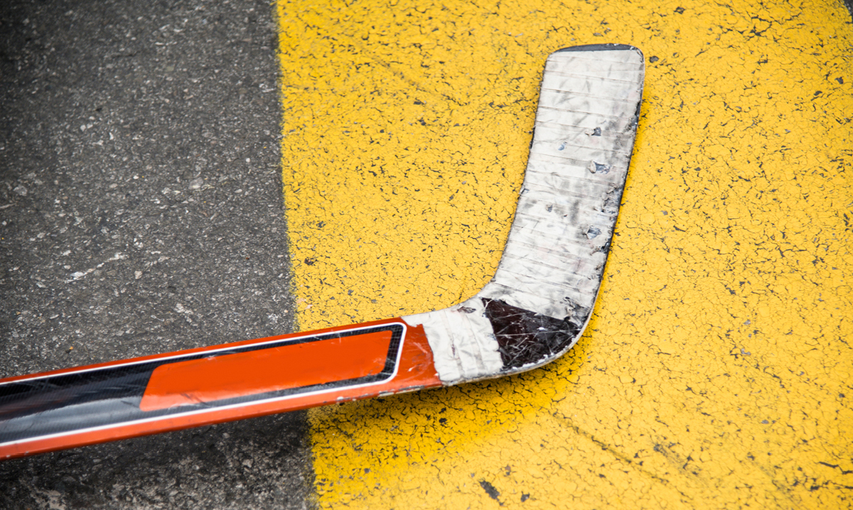 A hockey stick laying on the street