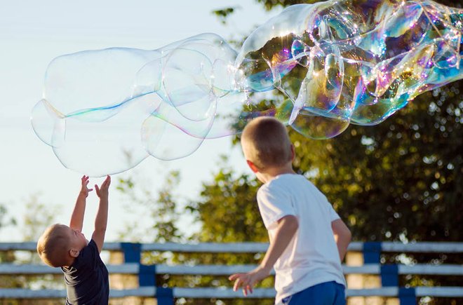 Kids playing with bubbles