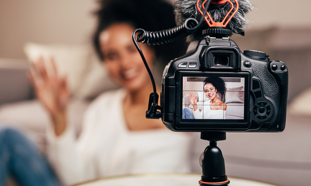 Black woman talking to a camera