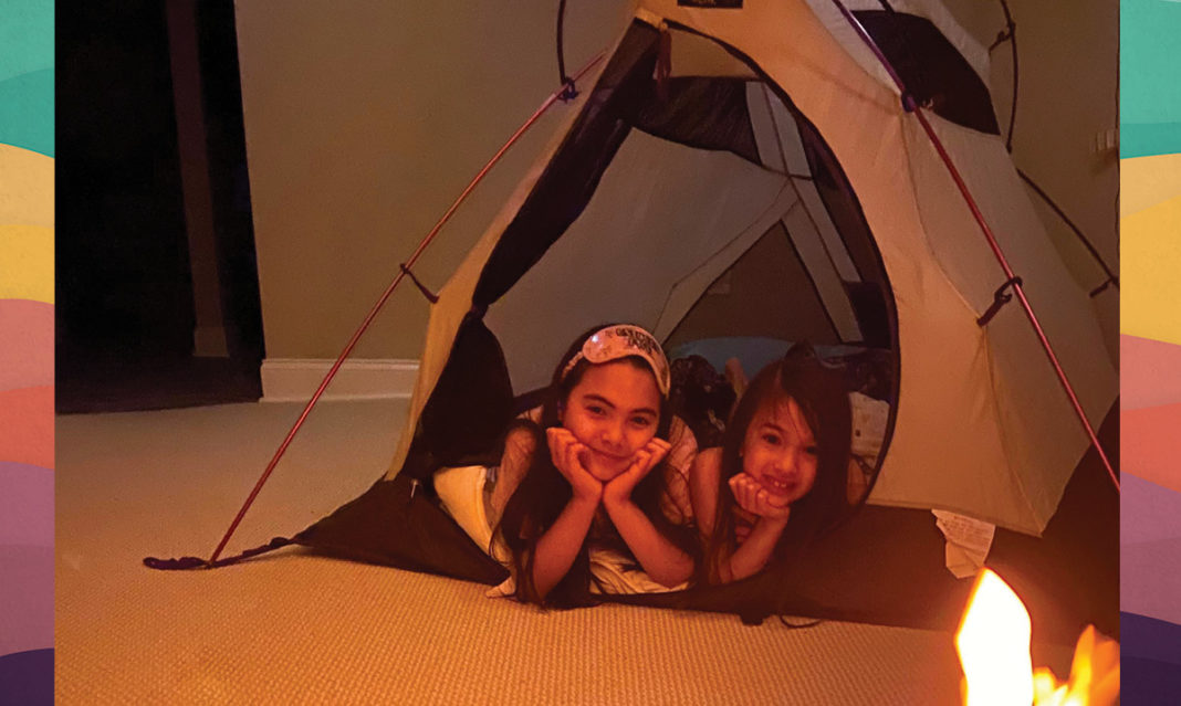 Kids in a tent in a living room