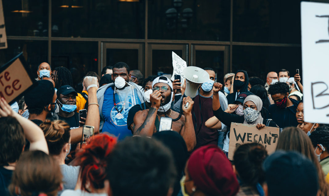 A man giving a speech at a Black Lives Matter protest