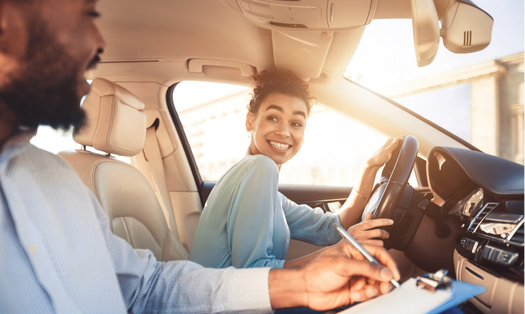 Teenager smiling and driving
