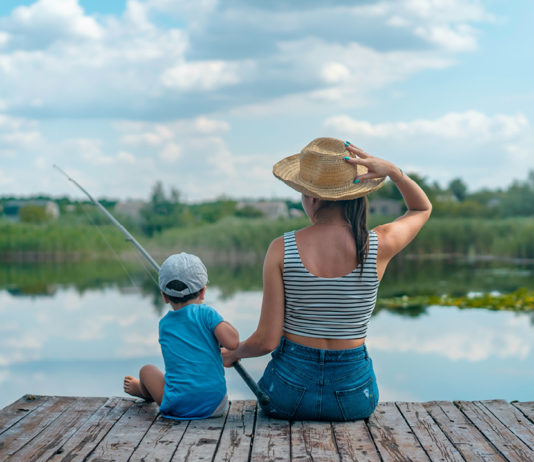 Woman and child fishing on a dock