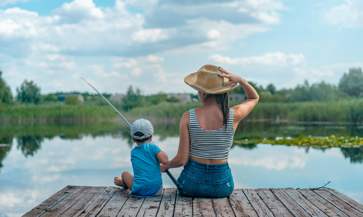 Woman and child fishing on a dock