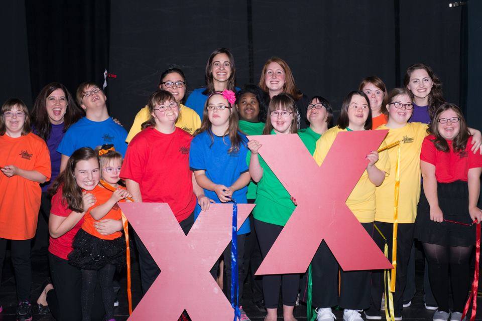 Group of actors post with two giant red Xs