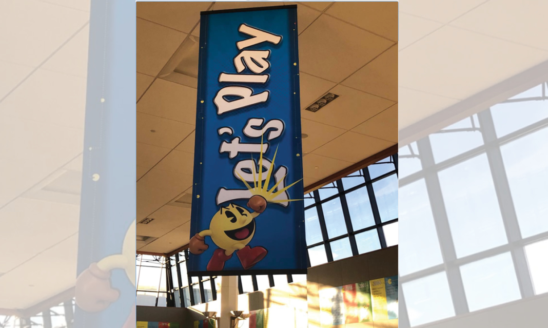 A banner from the Let's Play exhibit