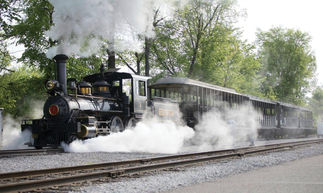 Image of the train at Greenfield Village surrounded by steam