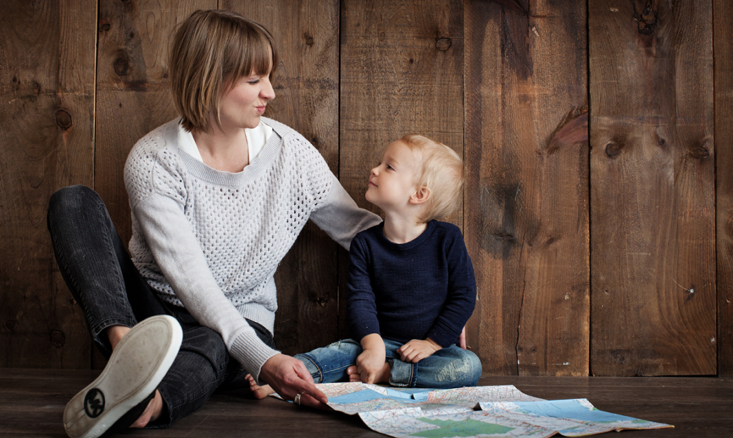 Woman making a scrunched up face at a child