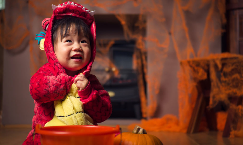 Baby in a dragon costume