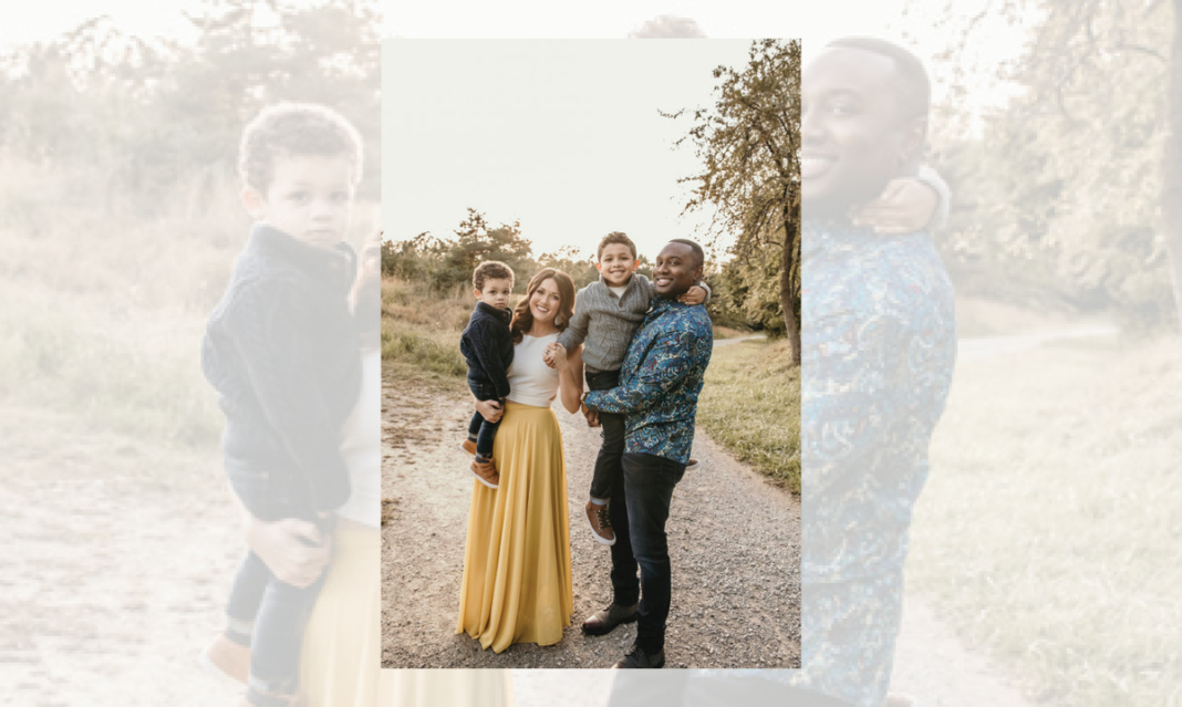 Evrod, his wife and their boys pose for a picture