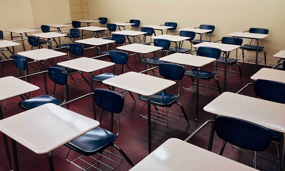 An empty classroom full of desks