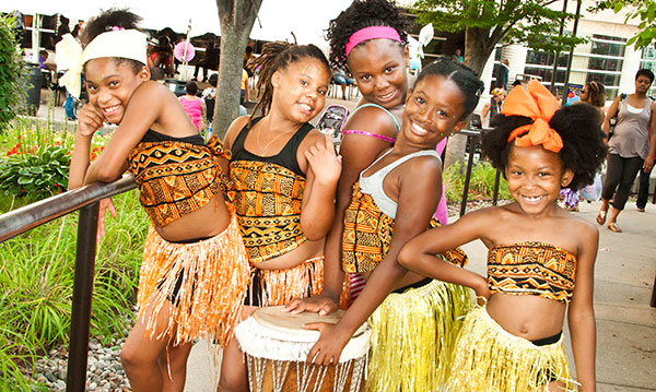 Five people in African-inspired clothing at the African World Festival