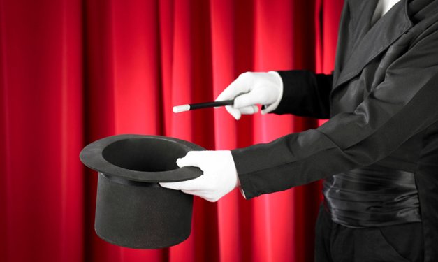 A magician doing a trick with a hat
