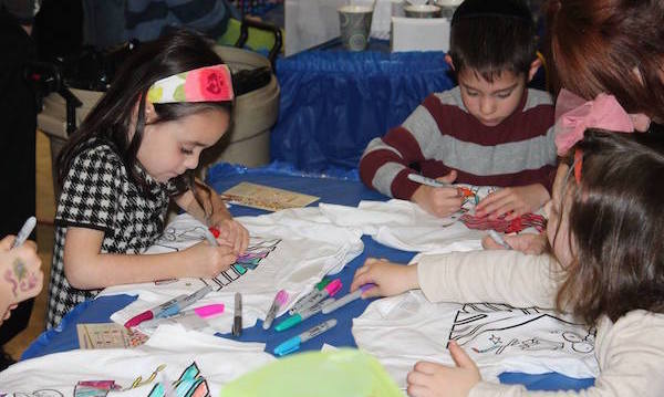 Kids doing crafts at Chanukah Wonderland