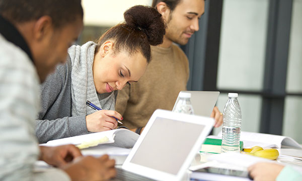 Three teens studying
