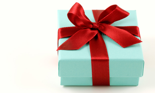 A teal and red-wrapped present on a white background