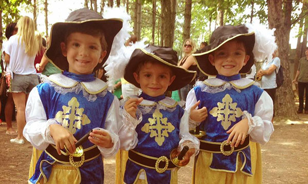 Three kids dressed up for the Michigan Renaissance Festival