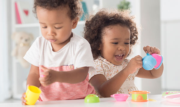 Two toddlers playing together