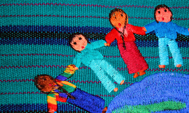 Sewed dolls holding hands
