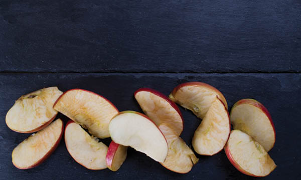 Brown apples on a blue background