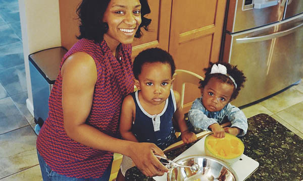 Cora Crowles cooking with two kids
