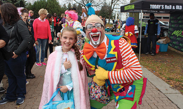 Child with a clown at the Zoo Boo