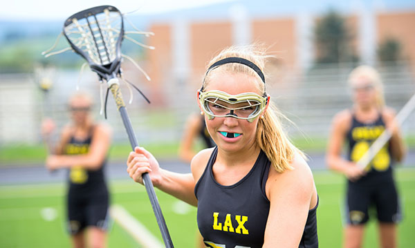 Girl playing lacrosse