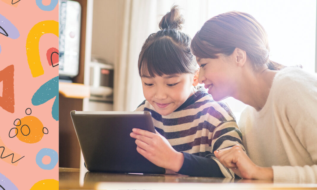 A child using a tablet to read an interactive book app