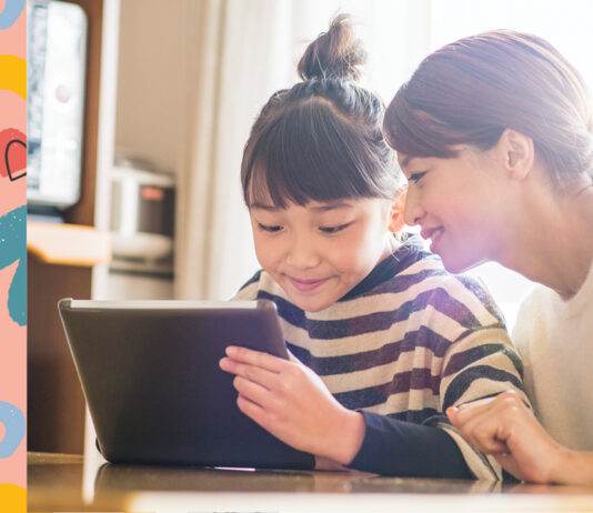A child using a tablet to read an interactive book app