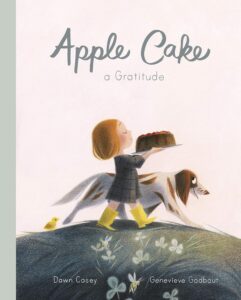 Cover of the children's book Apple Cake: A Gratitude by Dawn Casey, illustrated by Genevieve Godbout. The soft, whimsical illustration features a young girl carrying an apple cake while walking alongside a dog on a grassy hill, conveying themes of gratitude and appreciation for nature.
