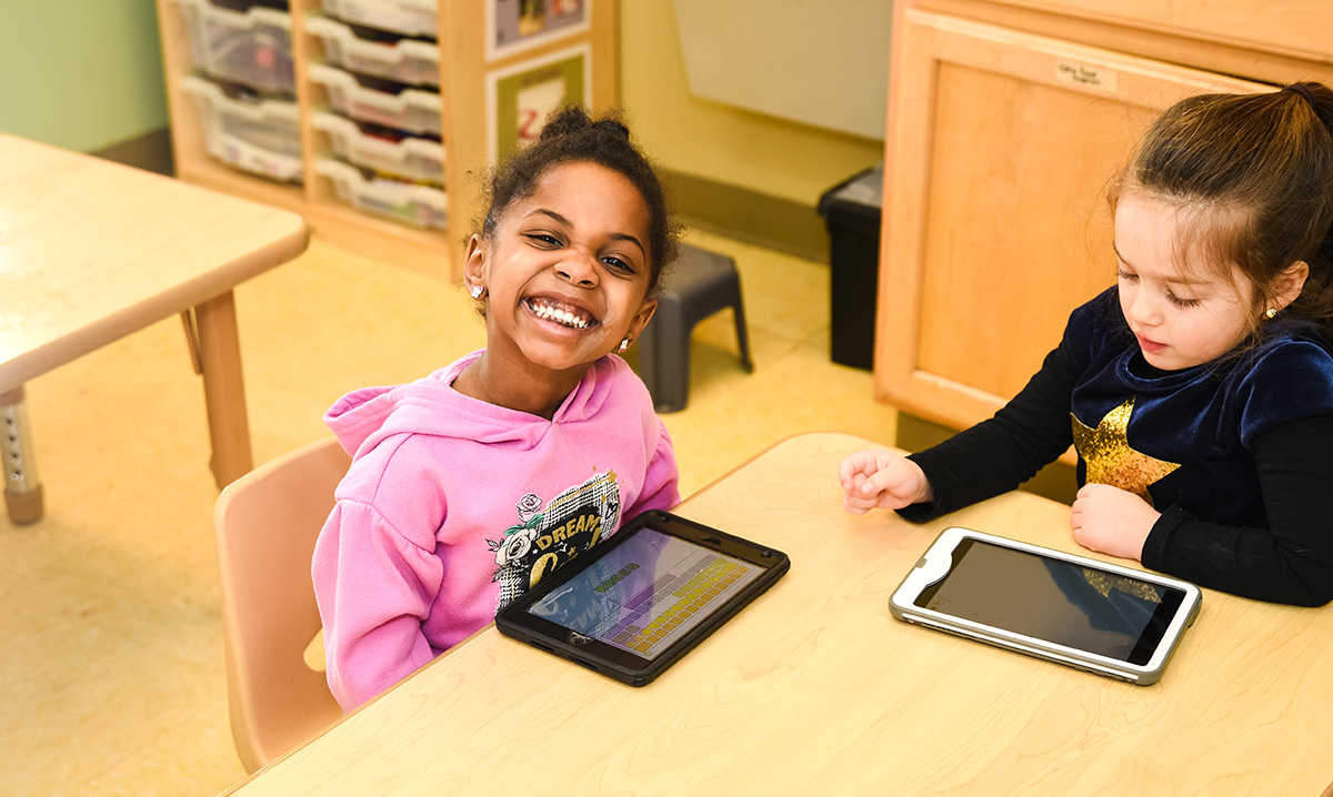 kindergarten-readiness-two-preschoolers-with-tablets-at-table