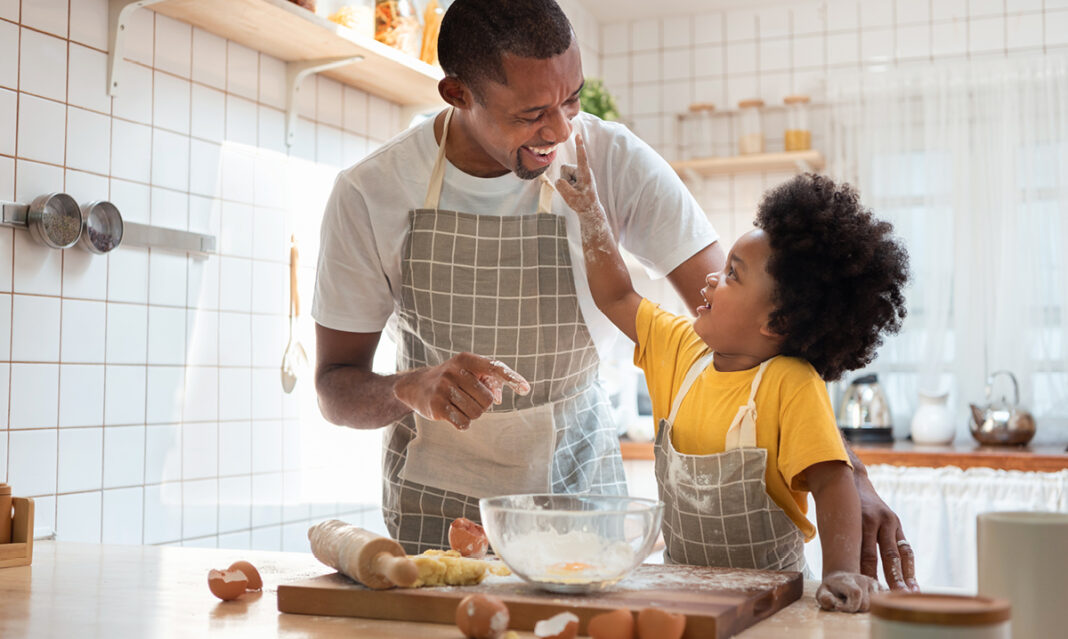 practice-gratitude-when-you-have-a-child-with-autim-dad-and-son-cooking-in-kitchen