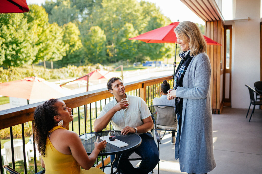 northern-michigan-wine-tour-couple-enjoying-dinner-in-traverse-city-michigan