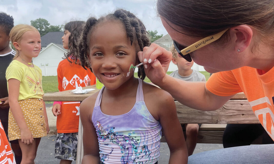 summer-ymca-activities-young-girl-getting-her-face-painted-at-camp