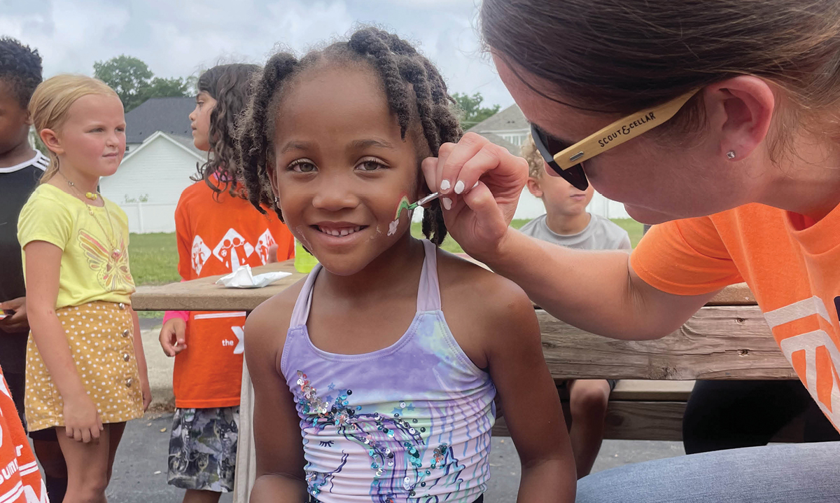 summer-ymca-activities-young-girl-getting-her-face-painted-at-camp