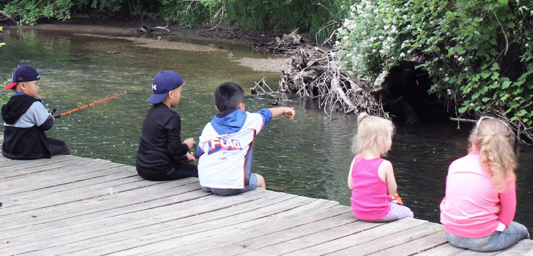 fishing-in-macomb-county-small-children-sitting-on-a-pier-fishing