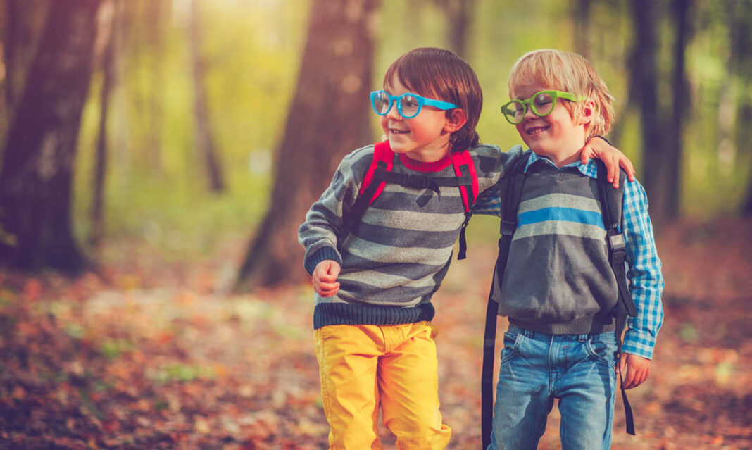 Little schoolboys in autumn