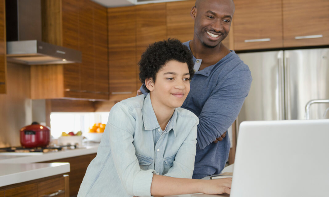 best-value-colleges-in-michigan-college-hopeful-looking-at-prices-online-with-dad