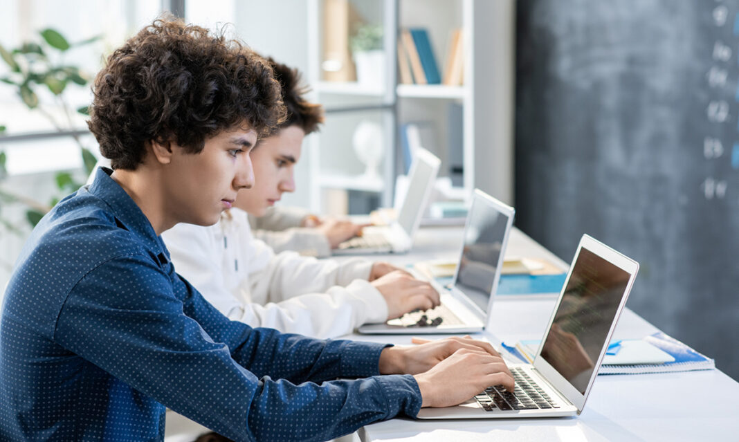 digital-sat-students-taking-the-new-college-entrance-exam-on-laptops
