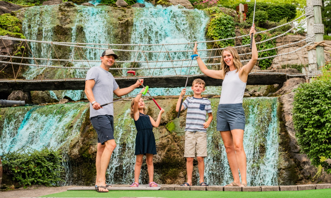 Family playing adventure golf in Traverse City