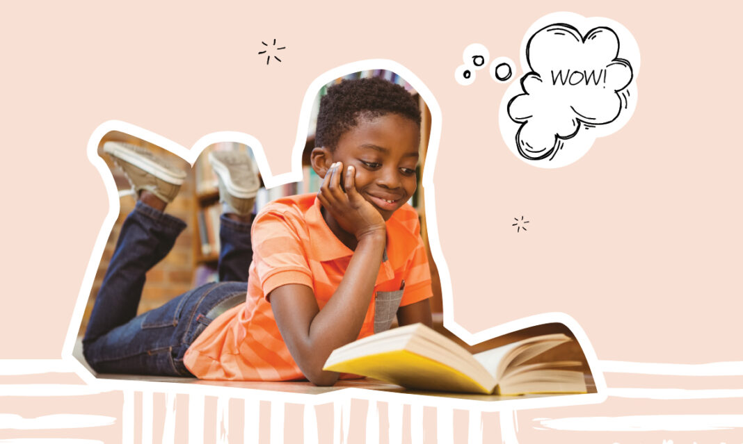 Child reading a graphic novel with colorful illustrations