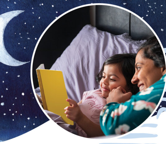 Why Reading Before Sleep Matters for Kids A parent reading a bedtime story to a child in a cozy bedroom setting