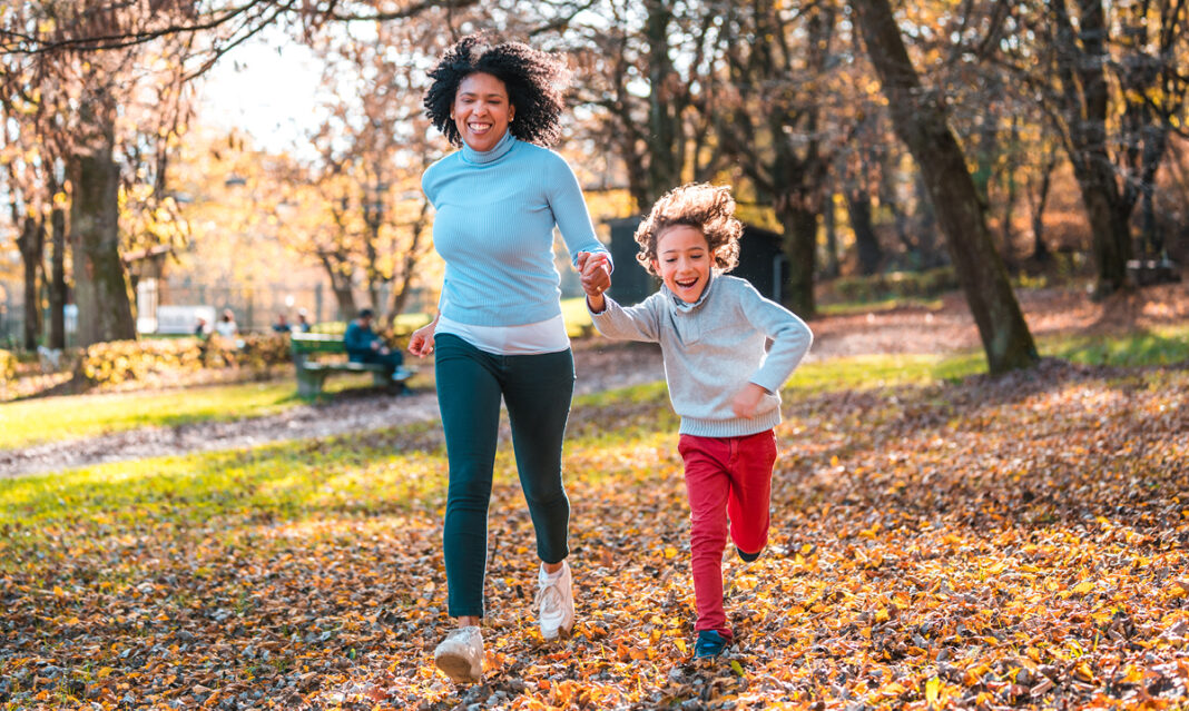 Mom with young daughter running
